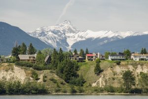 Canada: British Columbia, Invermere, Lake Windemere shoreline boat tour, housing on southwest side of lake, Purcell Mountains beyond