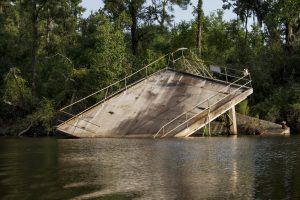 USA:  Louisiana, New Orleans, Lower Mississippi River Basin, Honey Island Swamp Tour, storm damage to dock