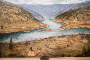 USA: Idaho,  Columbia River Basin, Snake River Basin, Lewiston, Nez Perce National Historic Park Visitor”s Center, painting of Nez Perce village by the confluence of the Snake (center above) and the Clearwater Rivers, Label reads:  "Ahsahka:  Acqua' aywawi"