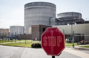 USA: Tennessee, Appalachia, Tennessee River Basin, SEJ Energy Tour, Sequoyah Nuclear Plant's twin reactor containment units, owned by Tennessee Valley Authority (TVA) and stop sign, PR