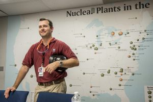 USA: Tennessee, Appalachia, Tennessee River Basin, SEJ Energy Tour, Sequoyah Nuclear Plant, owned by Tennessee Valley Authority (TVA), Sequoyah engineer Chris Reneau (MR) in front of map of US Nuclear Plants, PR