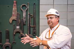 USA: Tennessee, Appalachia, Tennessee River Basin, SEJ Energy Tour, Chickamauga Dam owned by Tennessee Valley Authority (TVA), dam supervisor Tony Townsend (MR), displaying old wrenches for opening dam gates, PR