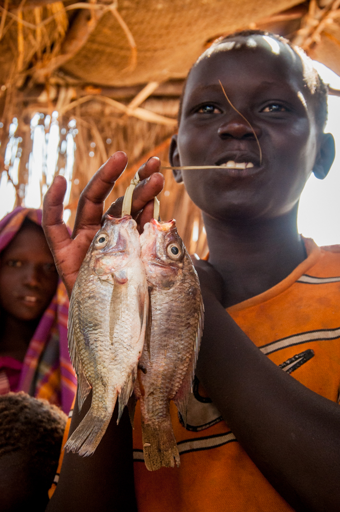 Turkana boy and tilapia fish he caught
